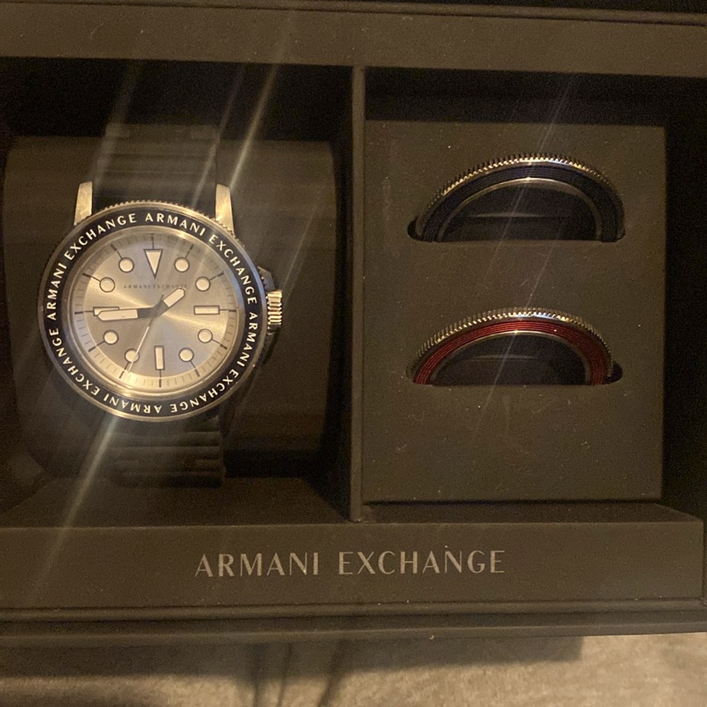 Armani Exchange's gift set includes red and blue interchangeable toprings